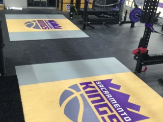 custom floor &amp; platform logos installed in athletic facility