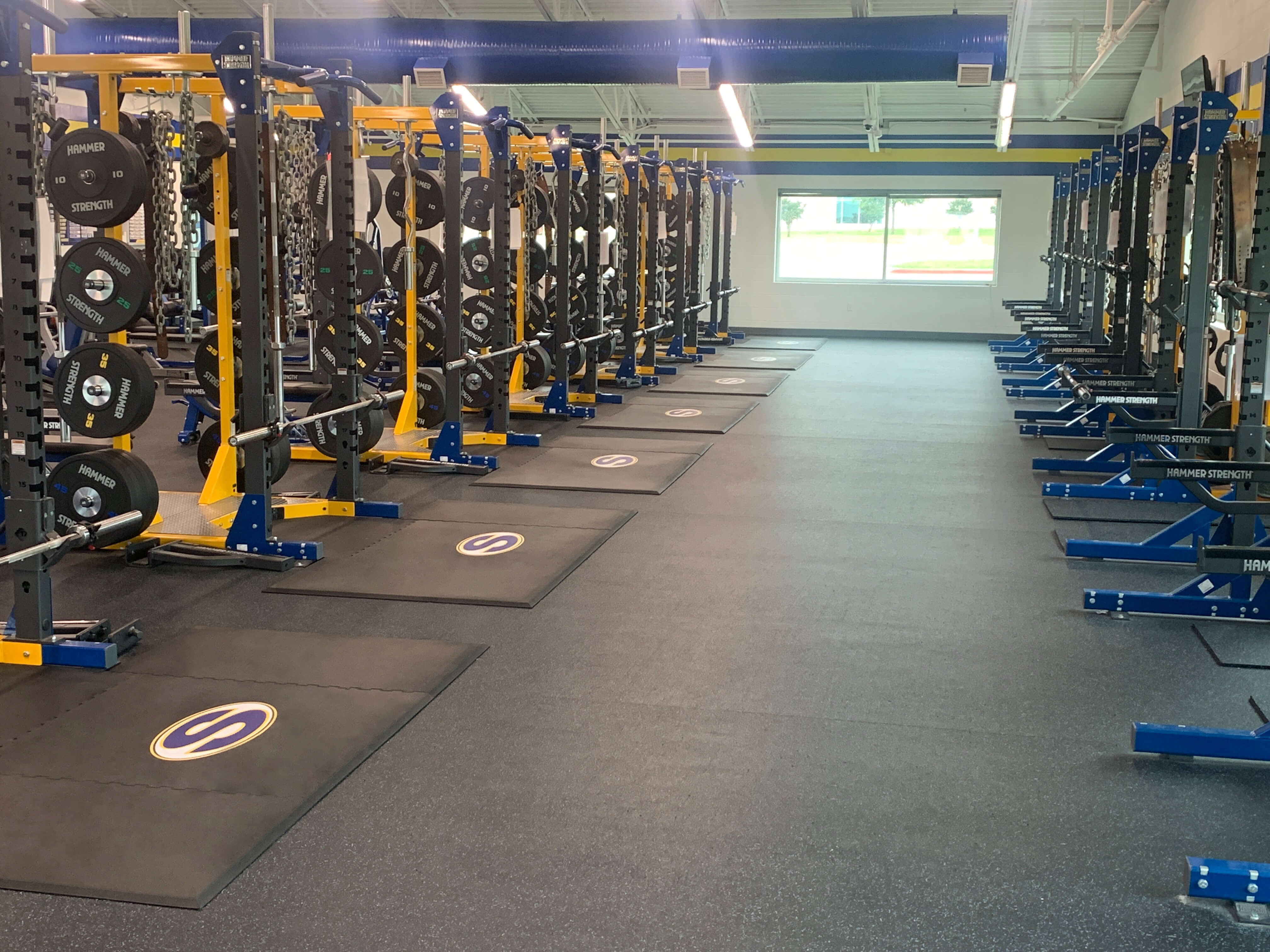 Sunnyvale High School weight room upgrade with all-rubber custom weightlifting platforms and logos