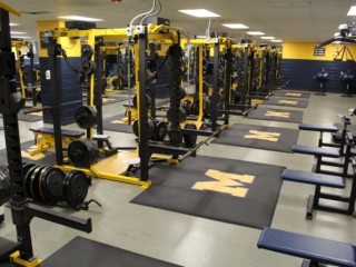 SVR Weightlifting Platforms & Custom Logos high school weight room with all rubber svr weightlifting platforms and m logos